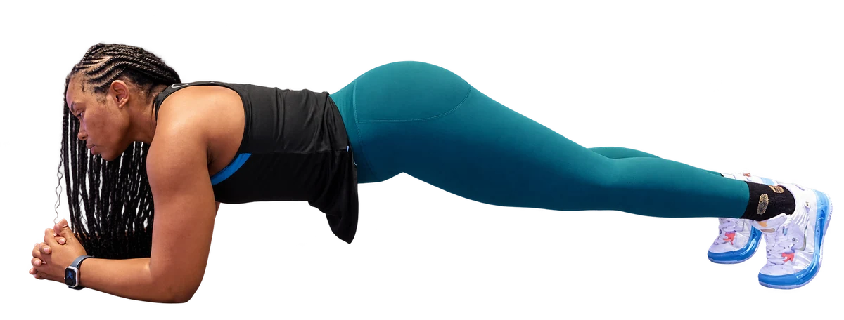 Tita demonstrating a forearm plank